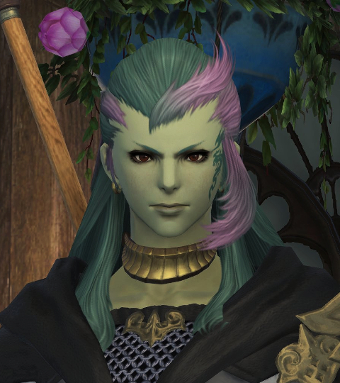 An early-game picture of Elakdornn Lyngtoumwyn. She's a light-green skinned Sea Wolf Roegadyn, with brown eyes, long dark green hair with pink highlights pulled back over her head, and she has a green seadragon tattoo on her right cheek.